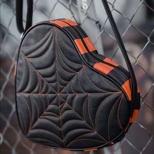 Love pain and stitches crossbody heart bag